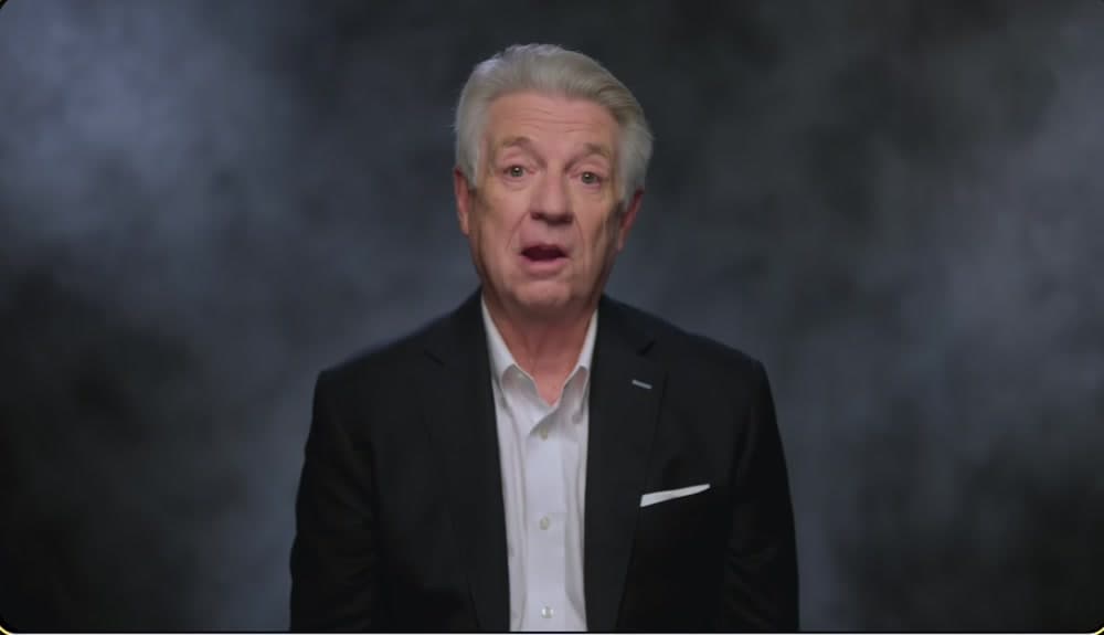 Jack Graham’s original filmed performance against a studio backdrop