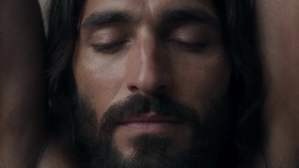 A close-up of Jesus, eyes closed, from the first courtyard take