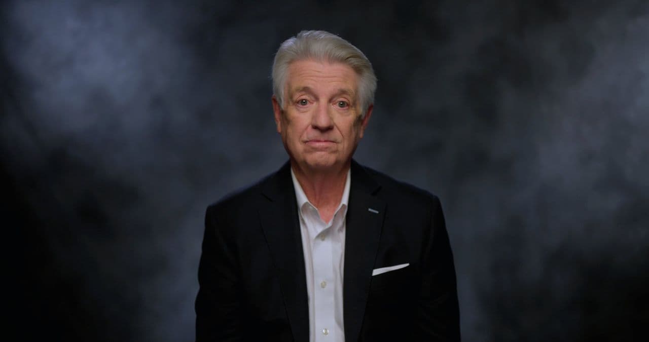 Pastor Jack Graham in a dark suit against a grey studio backdrop