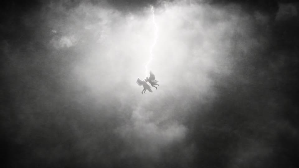 Shot 9: A lightning bolt splits the sky and silhouettes them.